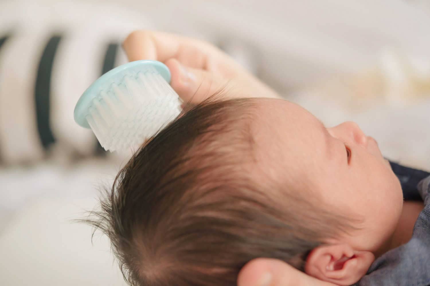 brushing baby hair.