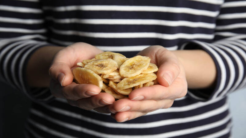 hand-full-of-banana-chips