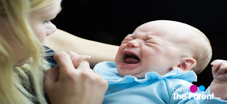 baby crying at the breast