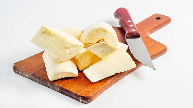 cassava root in cutting board