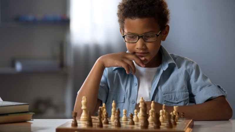 boy playing chess Board Games