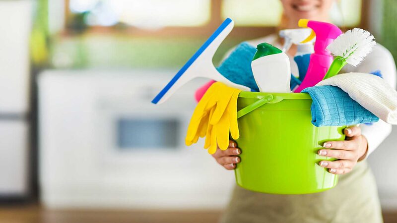 women-holding-household-items