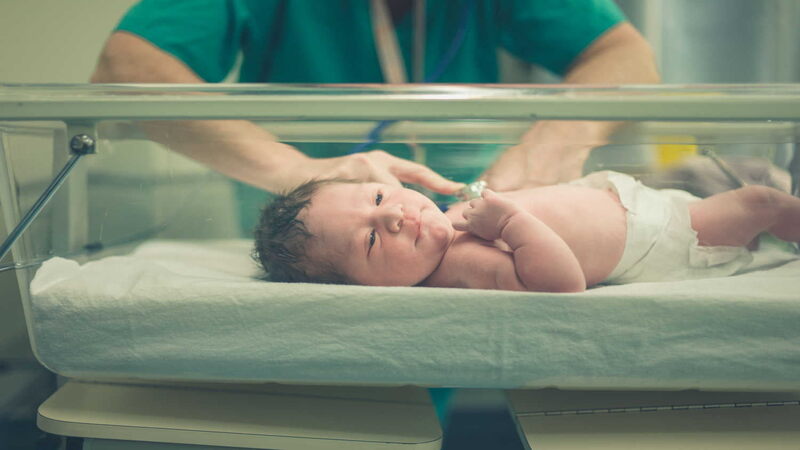 doctor-checking-newborn-baby