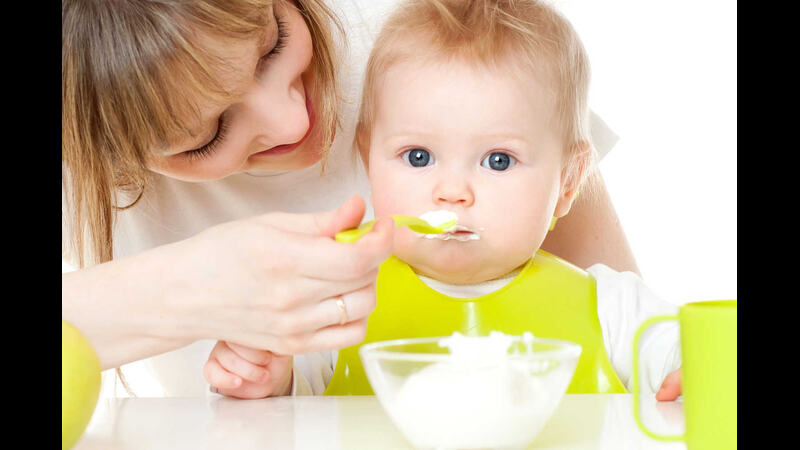 mom-feeding-baby-cheese