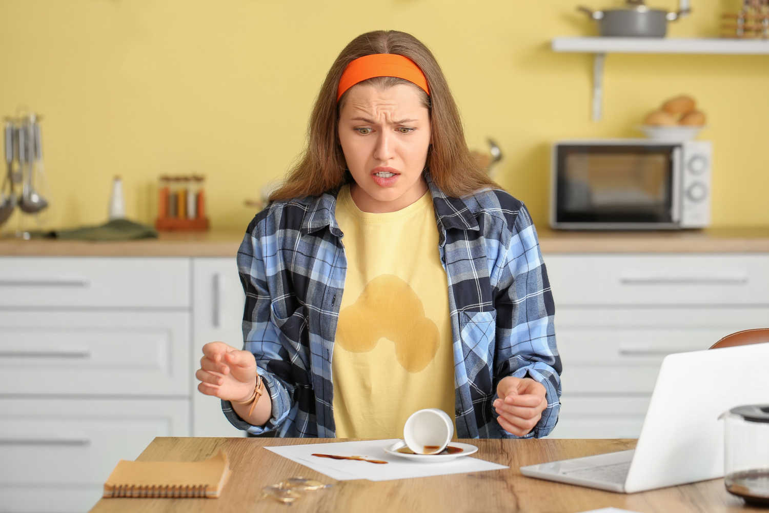 clumsy woman spilling coffee