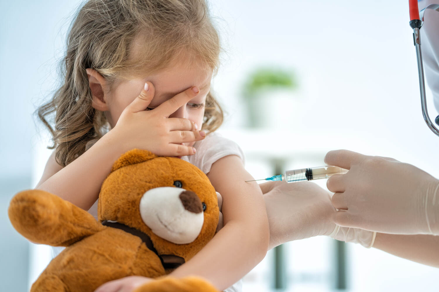 A toddler girl afraid of needle