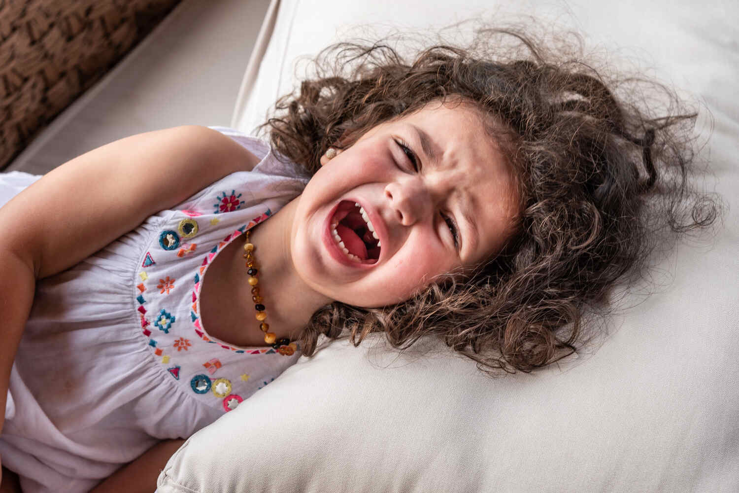 A toddler girl having a temper tantrum