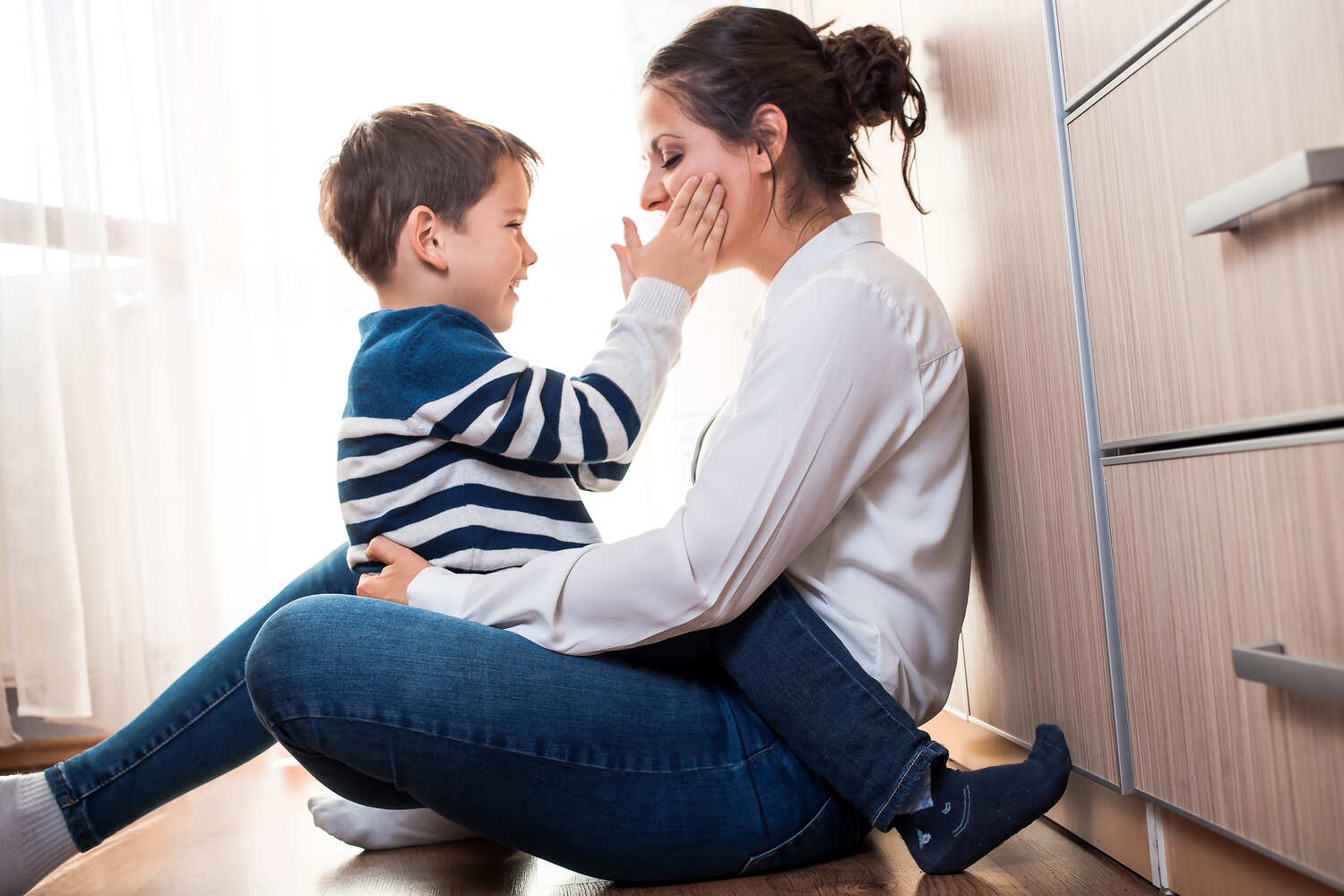 A mother and son talking