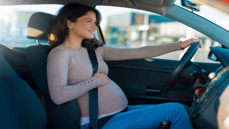 pregnant woman driving car