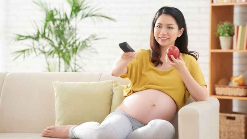 pregnant woman watching movie