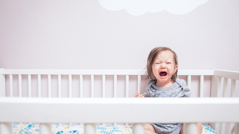 baby crying in crib