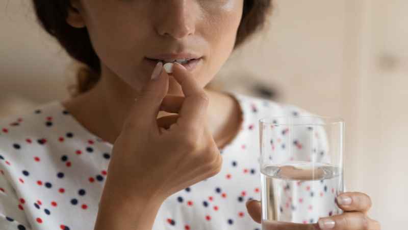 women taking medicine