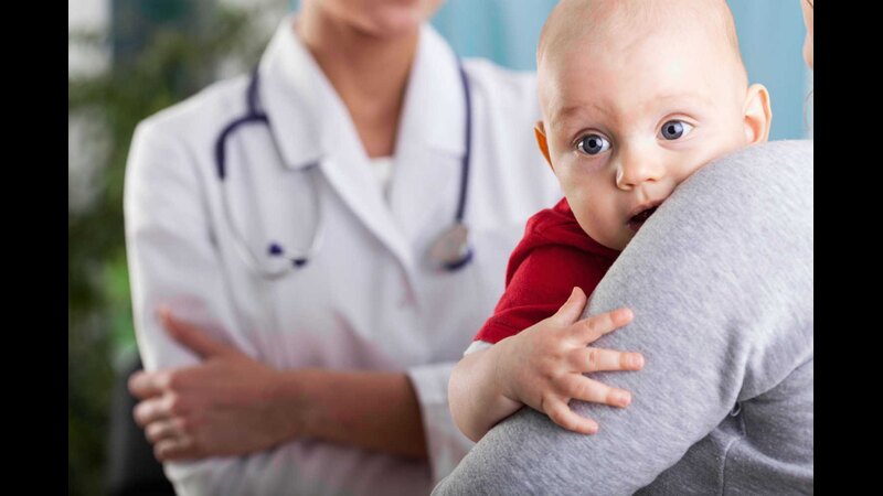 sick baby-in-moms-hand