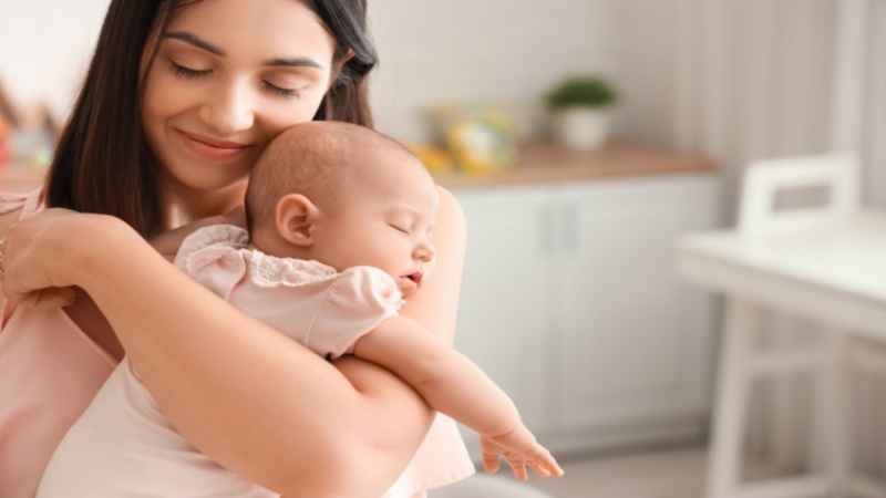 mom holding new born