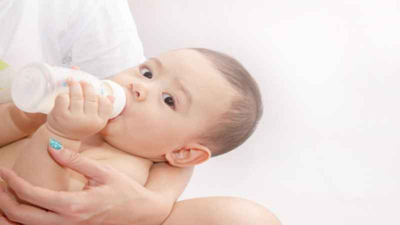 baby drinking formula milk